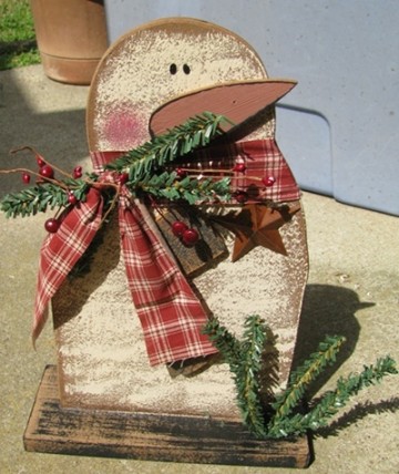 Wood Snowman on Base 47024S with Berries, metal star and tree branches Wood Snowman on Base 47024S with Berries, metal star and tree branches